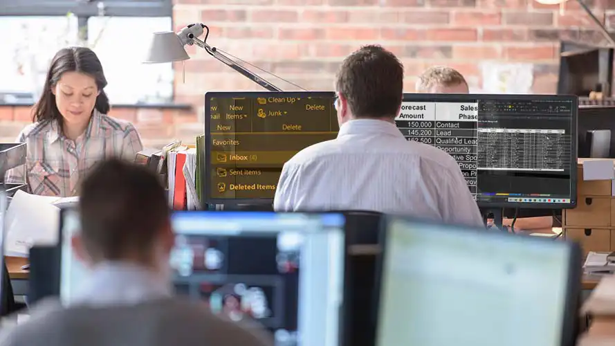 SuperNova magnification being used on multiple screens in a busy office